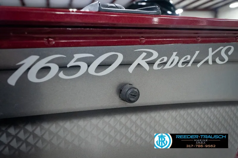 Slide: The Image of 2017 Lund 1650 Rebel XS SS boat detail with Reeder-Trausch Marine logo. - 58