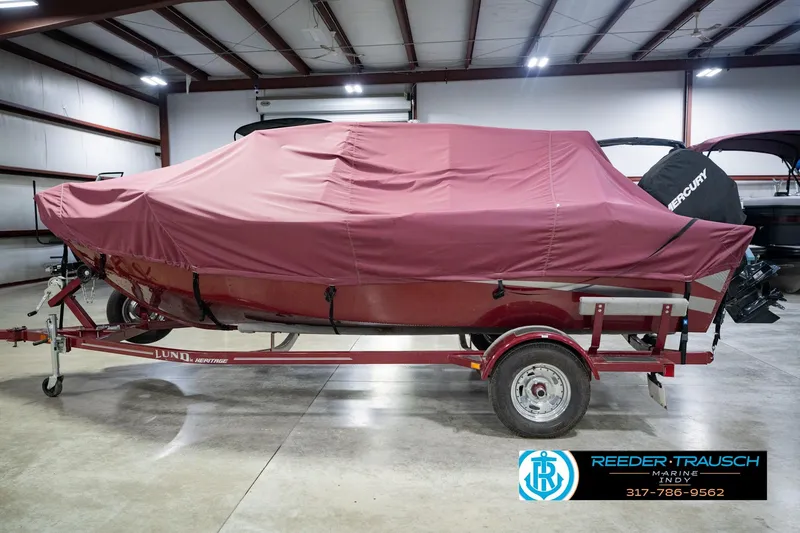 Slide: The Image of 2017 Lund 1650 Rebel XS SS boat covered, on trailer in indoor storage facility. - 63