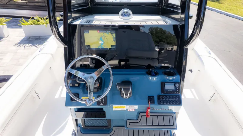 Slide: The Image of 2026 Tidewater 2500 Carolina Bay helm with navigation system. - 10