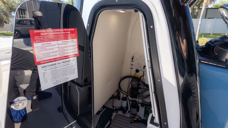 Slide: The Image of Interior of 2026 Tidewater 2500 Carolina Bay with warning notices. - 14