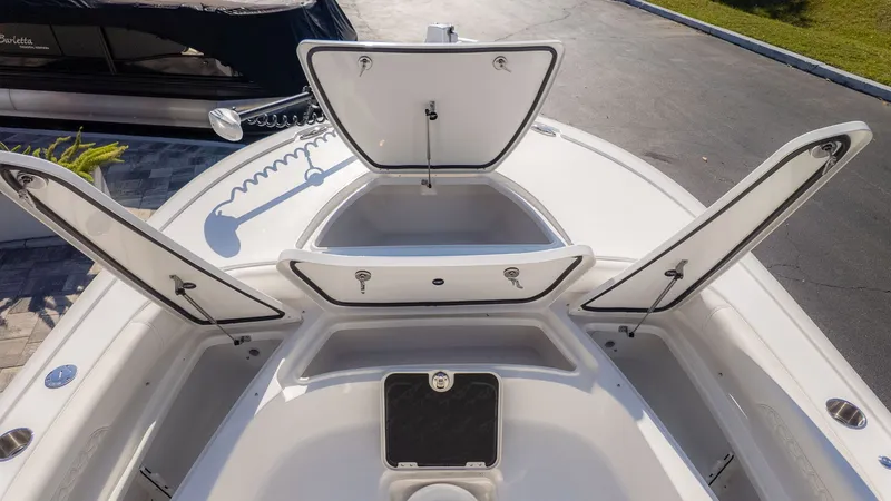 Slide: The Image of 2026 Tidewater 2500 Carolina Bay with open storage compartments. - 20