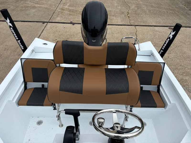 Slide: The Image of Interior of 2026 Xpress H20B HYPER-LIFT BAY with brown and black seating. - 8