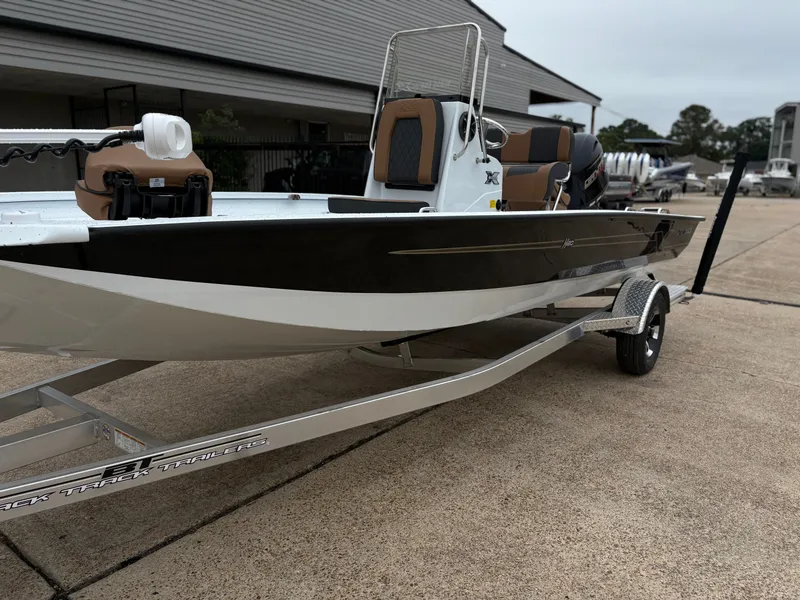 Slide: The Image of 2026 Xpress H20B HYPERLIFT-BAY boat on trailer, side view. - 4