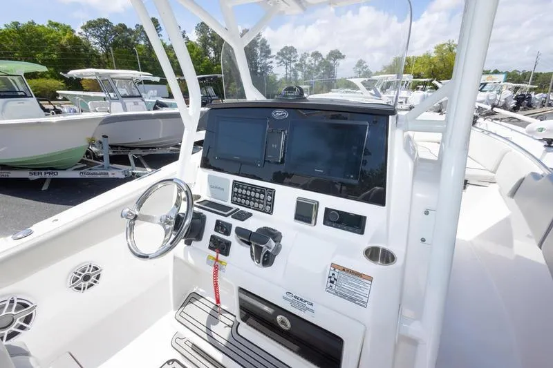 Slide: The Image of 2023 Sea Fox 288 Commander boat dashboard with modern controls and navigation systems. - 12