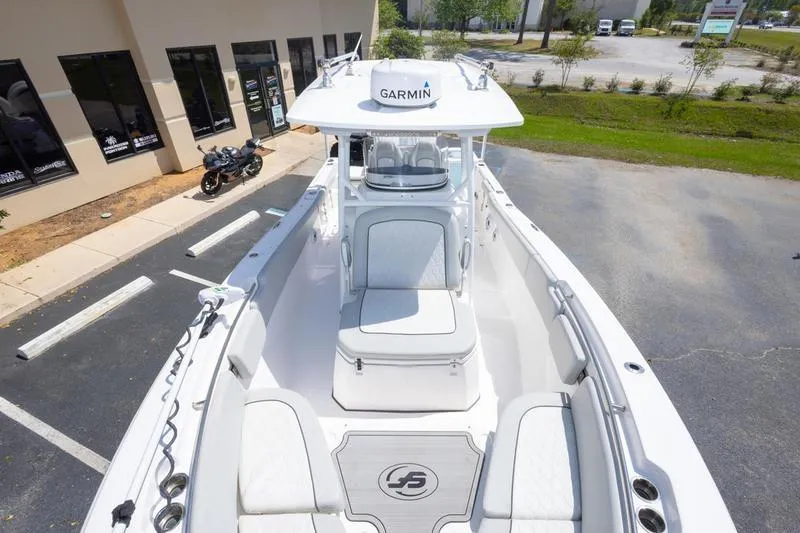 Slide: The Image of 2023 Sea Fox 288 Commander boat with Garmin equipment, parked near a building. - 16