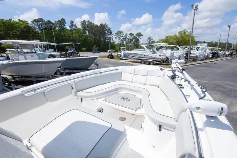Slide: The Image of 2023 Sea Fox 288 Commander boat with spacious seating, displayed outdoors under a clear sky. - 19