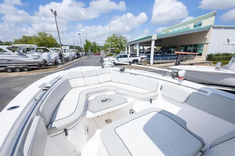 Slide: The Image of 2023 Sea Fox 288 Commander boat with spacious seating at a dealership. - 20