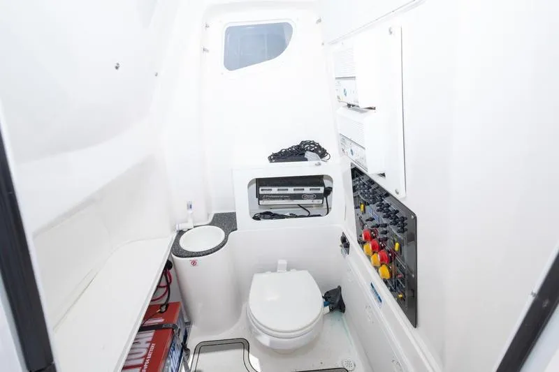 Slide: The Image of 2023 Sea Fox 288 Commander boat interior with toilet and control panel. - 22