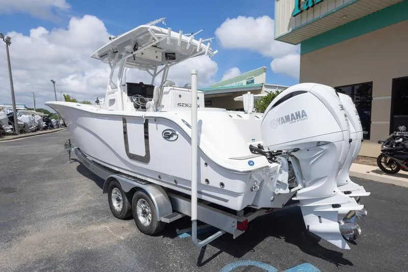 Slide: The Image of 2023 Sea Fox 288 Commander boat with Yamaha engines on a trailer. - 4
