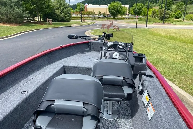 Slide: The Image of 2026 Tracker Super Guide V-16 SC boat interior with dual seats and steering console. - 5