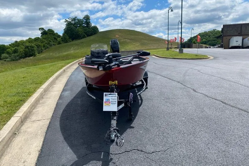 Slide: The Image of 2026 Tracker Super Guide V-16 SC boat on trailer in parking lot. - 4