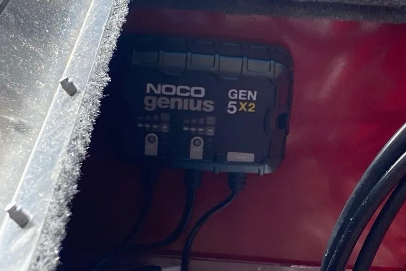 Slide: The Image of NOCO Genius GEN 5X2 charger in 2026 Tracker Super Guide V-16 SC boat. - 6