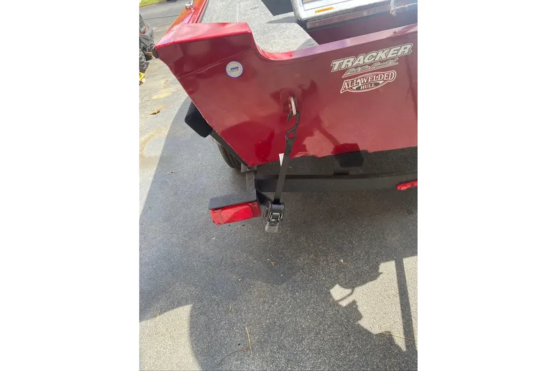 Slide: The Image of Red Tracker Super Guide V-16 SC boat, 2026 model, with all-welded hull on trailer. - 7
