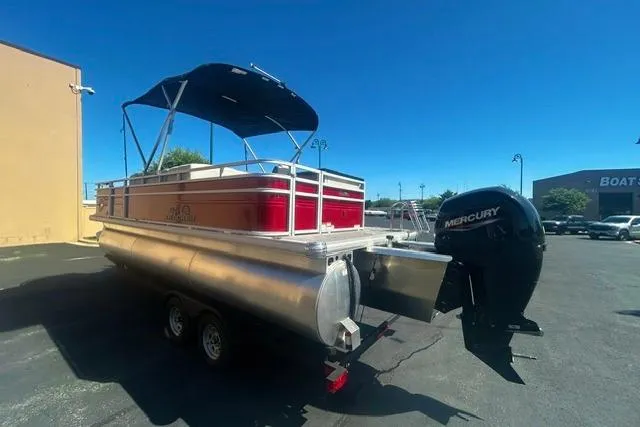 Slide: The Image of 2026 Sun Tracker Fishin' Barge 22 XP3 pontoon boat with Mercury outboard motor. - 3