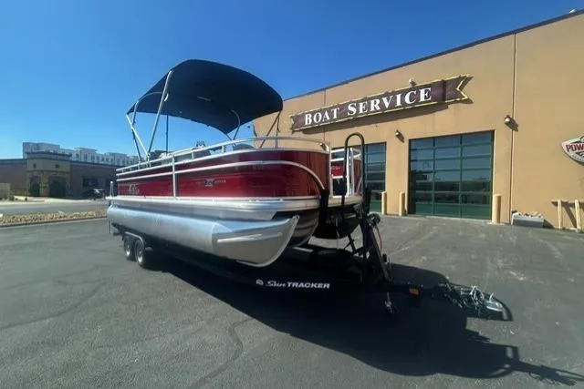 The Image of 2026 Sun Tracker Fishin' Barge 22 XP3 pontoon boat at service center. - 0