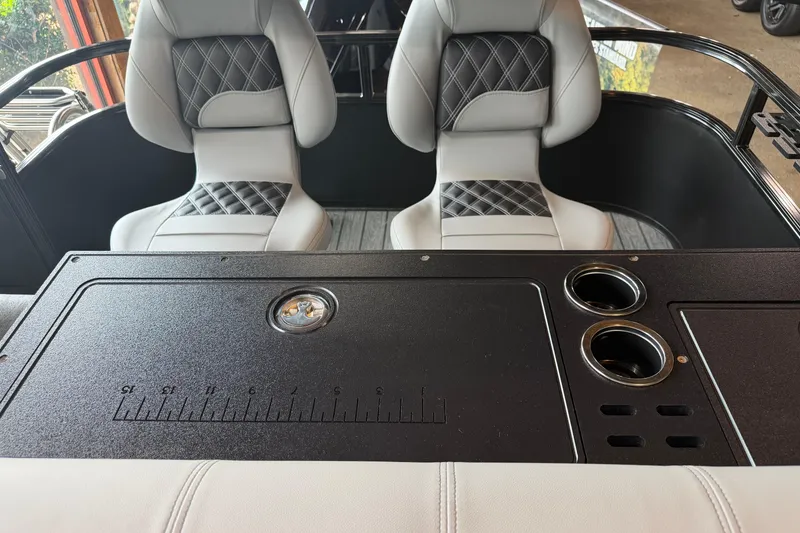 Slide: The Image of Interior of 2026 Ranger 223FC boat with stylish seating and functional console. - 2
