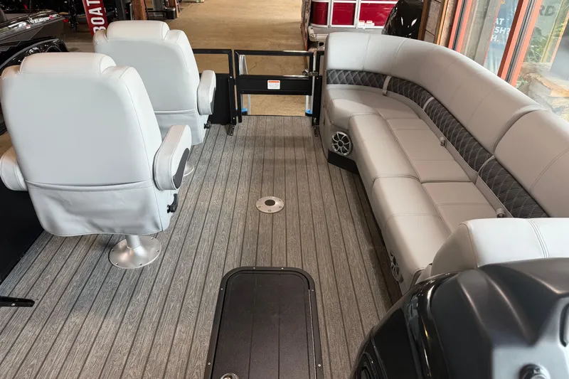The Image of Interior of 2026 Ranger 223FC boat with gray seating and wood-style flooring. - 0