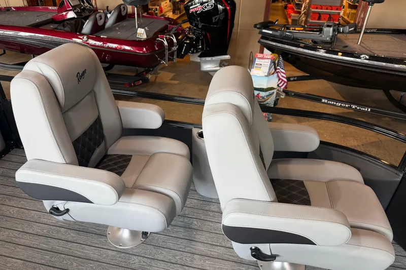 Slide: The Image of Luxury seating on a 2026 Ranger 223FC boat, featuring plush gray upholstery and modern design. - 10