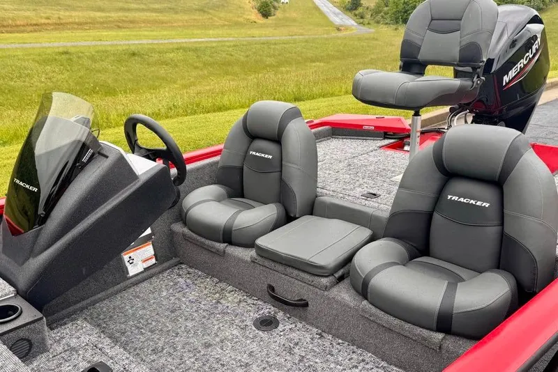 Slide: The Image of 2026 Tracker Pro Team 175 boat interior with gray seating and steering console. - 9