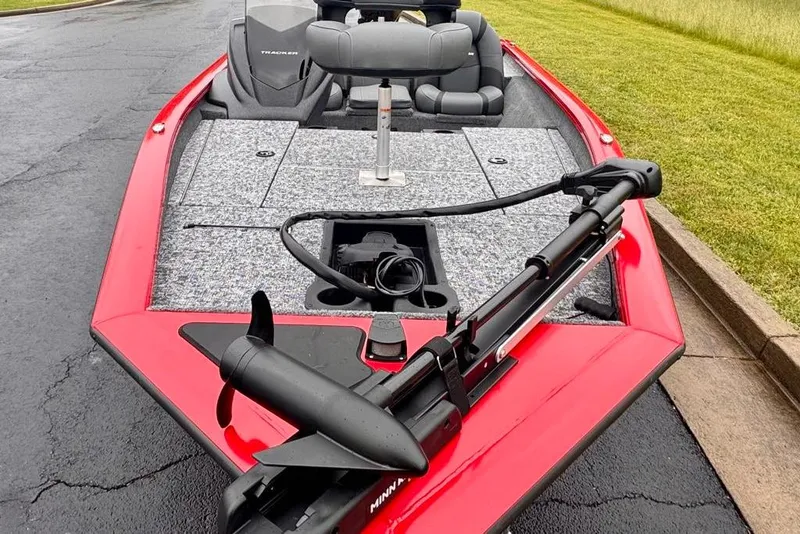 Slide: The Image of 2026 Tracker Pro Team 175 boat with red exterior and trolling motor. - 6