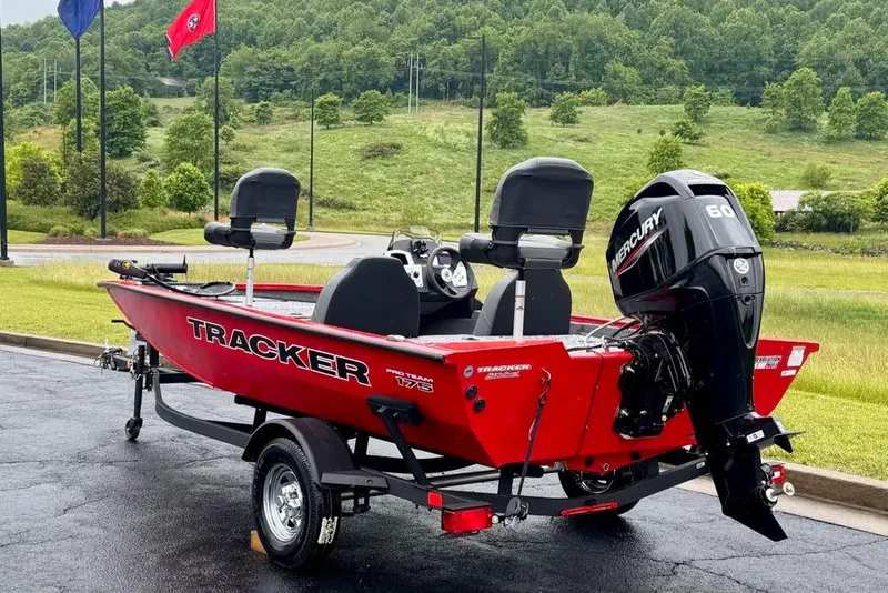 Slide: The Image of 2026 Tracker Pro Team 175 boat with Mercury 60 engine, parked outdoors. - 4