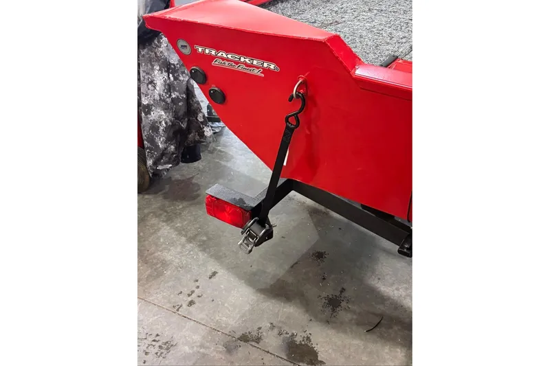 Slide: The Image of Red 2026 Tracker Pro Team 175 boat rear view with trailer attachment. - 11