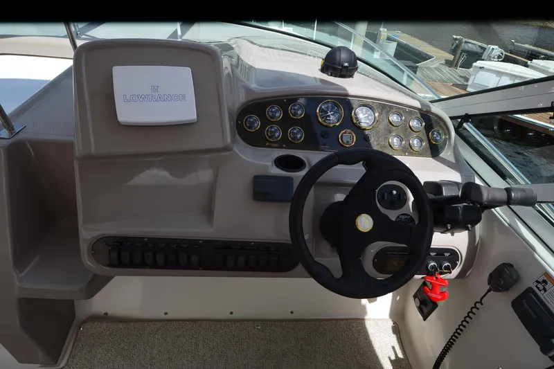 Slide: The Image of Helm of 2004 Cruisers Yachts 340 Express with Lowrance navigation system. - 14