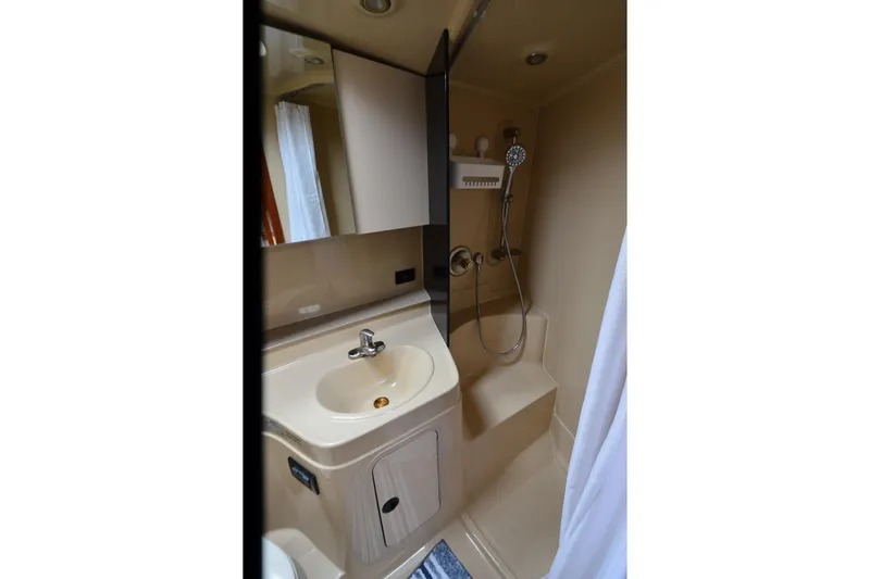 Slide: The Image of Bathroom interior of 2004 Cruisers Yachts 340 Express with sink and shower. - 31