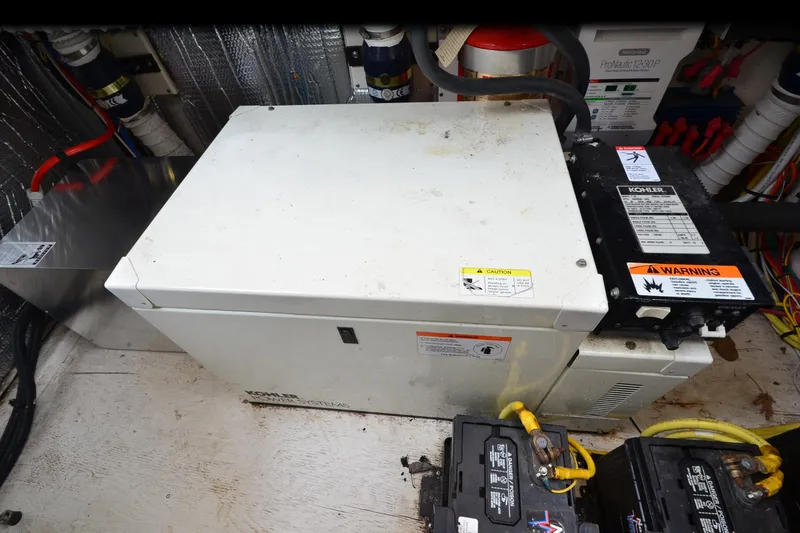 Slide: The Image of Engine room of 2004 Cruisers Yachts 340 Express with Kohler power system and batteries. - 34