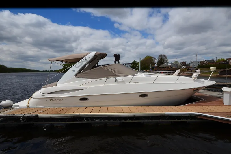 Slide: The Image of 2004 Cruisers Yachts 340 Express docked on a sunny day. - 5