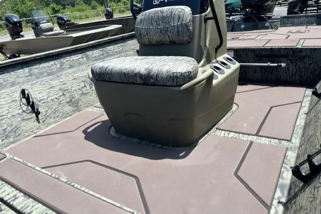 Slide: The Image of 2026 Tracker Grizzly 2072 CC boat interior with camo seating and spacious deck. - 11