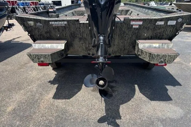 Slide: The Image of 2026 Tracker Grizzly 2072 CC boat rear view with motor and camouflage design. - 17