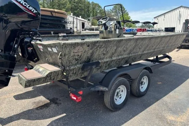Slide: The Image of 2026 Tracker Grizzly 2072 CC boat on trailer, parked outdoors. - 6