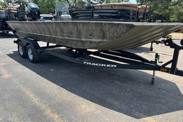 Slide: The Image of 2026 Tracker Grizzly 2072 CC boat on trailer, parked outdoors. - 8