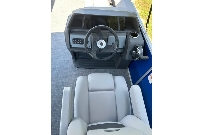 Slide: The Image of 2026 Sun Tracker Party Barge 18 DLX helm with steering wheel and controls. - 7