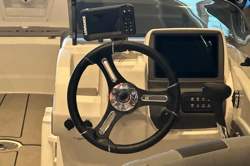 Slide: The Image of Steering wheel and dashboard of 2026 Tahoe T21 boat with navigation system. - 4