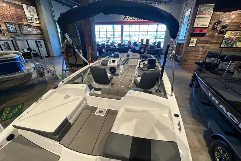 Slide: The Image of 2026 Tahoe T21 boat interior in showroom, featuring sleek seating and modern design. - 3