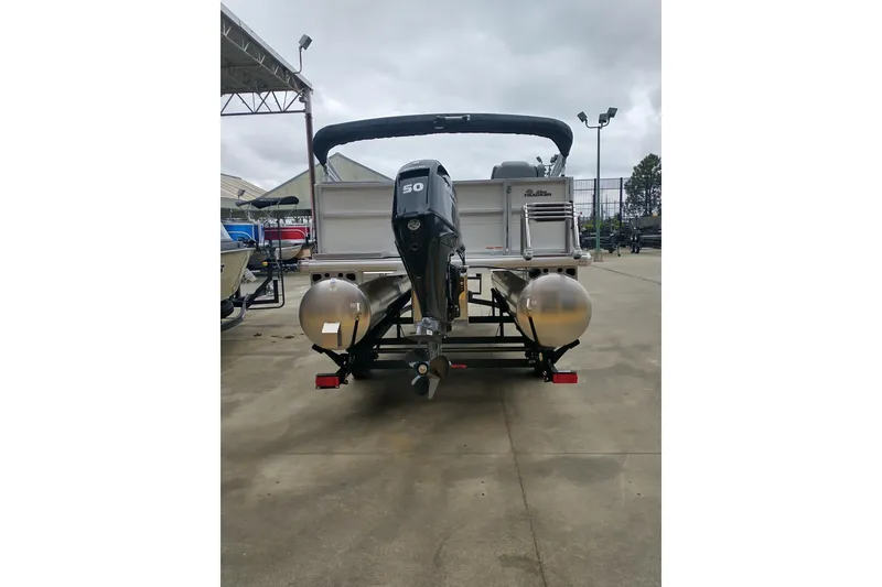 Slide: The Image of 2026 Sun Tracker Party Barge 16 DLX pontoon boat with 50 HP motor, rear view. - 6