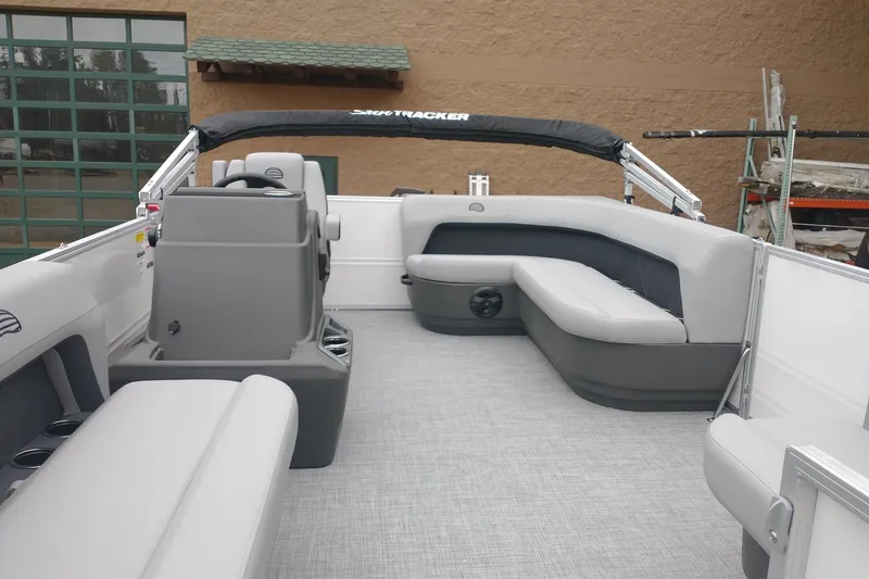 Slide: The Image of 2026 Sun Tracker Party Barge 16 DLX interior with spacious seating and modern design. - 7
