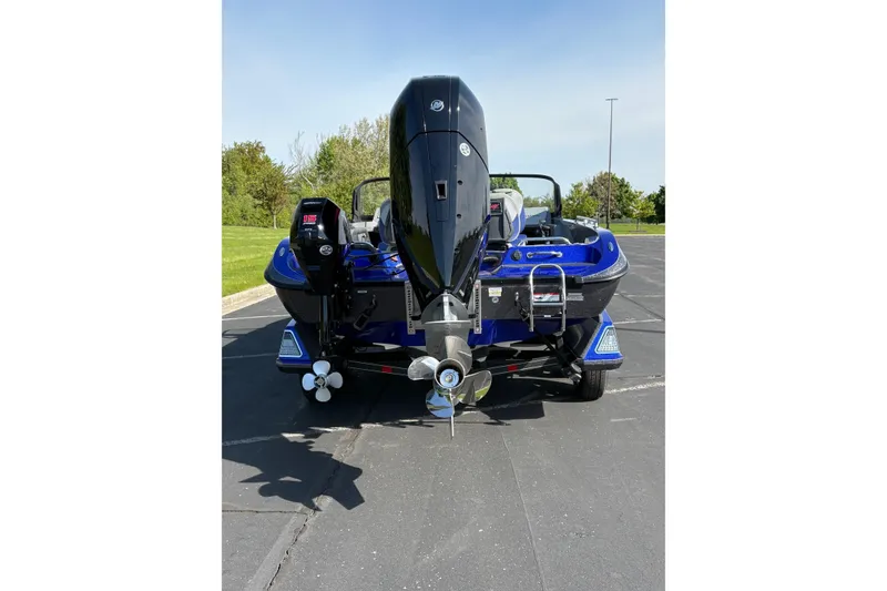 Slide: The Image of 2026 Ranger 621FS Cup-Equipped boat, rear view with powerful outboard motor. - 2