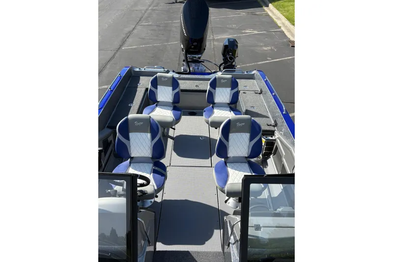 Slide: The Image of 2026 Ranger 621FS Cup-Equipped boat interior with blue and white seating. - 4