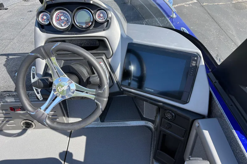 Slide: The Image of 2026 Ranger 621FS Cup-Equipped boat dashboard with steering wheel and Garmin display. - 7