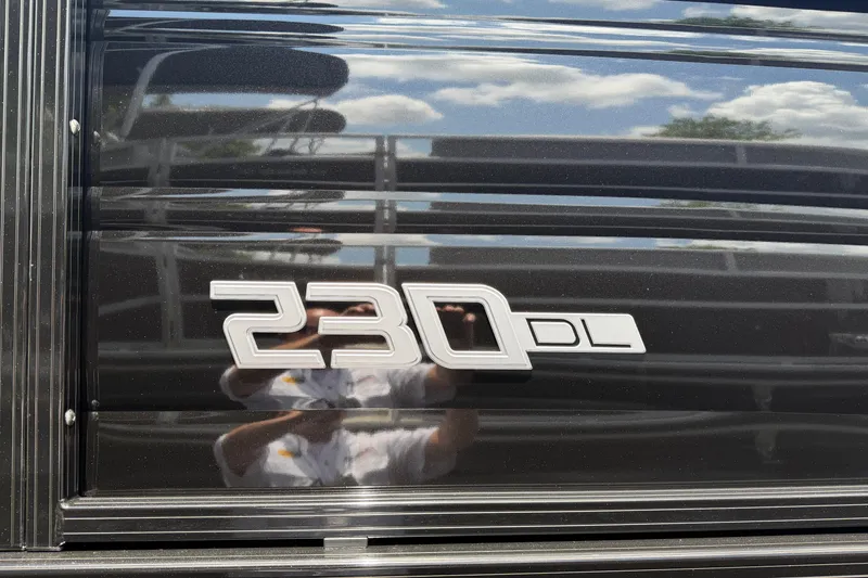 Slide: The Image of Close-up of 2026 Regency 230 DL logo on sleek black surface. - 16