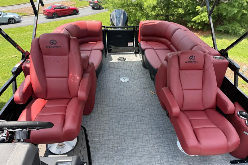 Slide: The Image of Luxurious 2026 Regency 230 DL boat interior with red leather seating and modern design. - 7