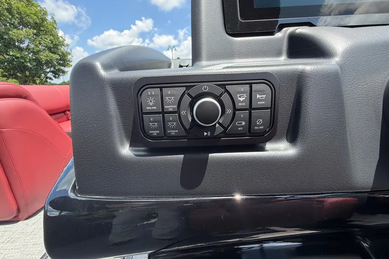 Slide: The Image of Control panel of 2026 Regency 230 DL boat with various function buttons. - 12
