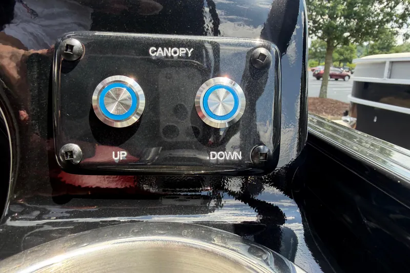 Slide: The Image of Control panel for canopy adjustment on 2026 Regency 230 DL boat. - 13