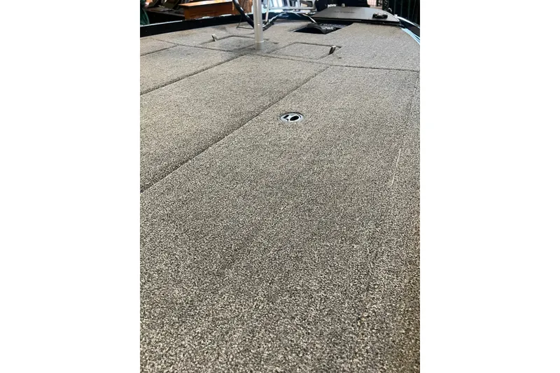 Slide: The Image of 2026 Nitro Z21 XL boat deck with textured surface and hatch. - 14