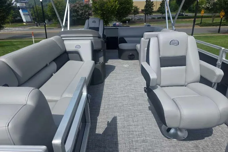 Slide: The Image of 2026 Sun Tracker SportFish 20 DLX pontoon boat interior with plush seating and modern design. - 12