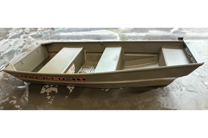 The Image of 2026 Tracker Grizzly 10 Jon boat on wet concrete surface. - 0