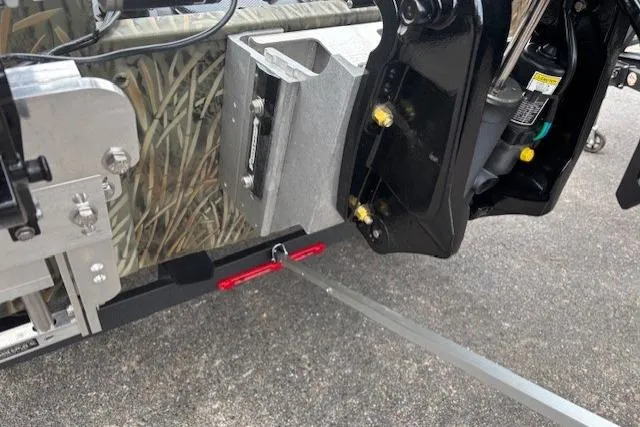 Slide: The Image of 2026 Tracker Grizzly 2072 CC Sportsman Kicker boat detail, featuring motor mount and camouflage design. - 16